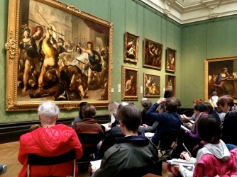 An art class in The National Gallery recreating their own versions of Luca Giordano's Perseus Turning Phineas and his Followers to Stone